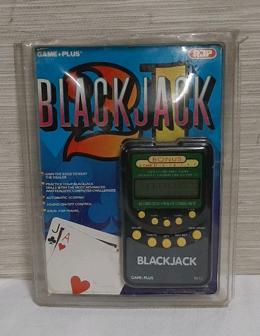 Vintage Hand Held Black Jack Game. Package has been opened but the game looks untouched.