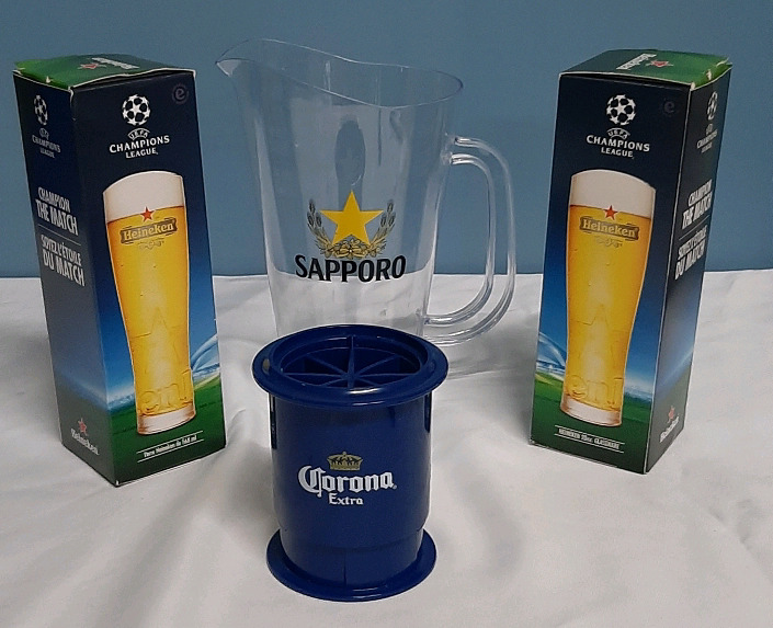 2 Heineken Glasses A Supporo Pitcher and a Corona Lime Slicer