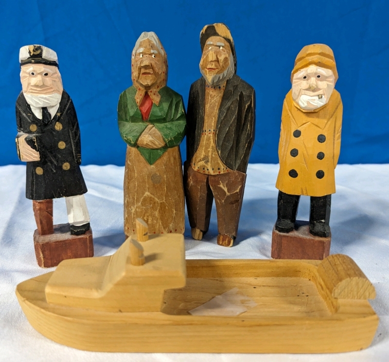 Collection of Carved Fisherman Figures and Wooden Boat.