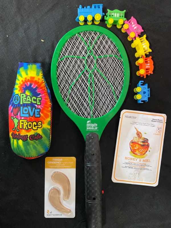 Candle Birthday train , rainforest cafe beer cozy , a mosquito shield , face mask and eye mask