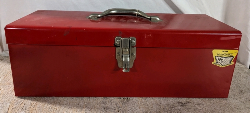 Toolbox with assorted tools and hardware.