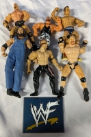 6 Assorted Wrestling Figures + WWF Stand