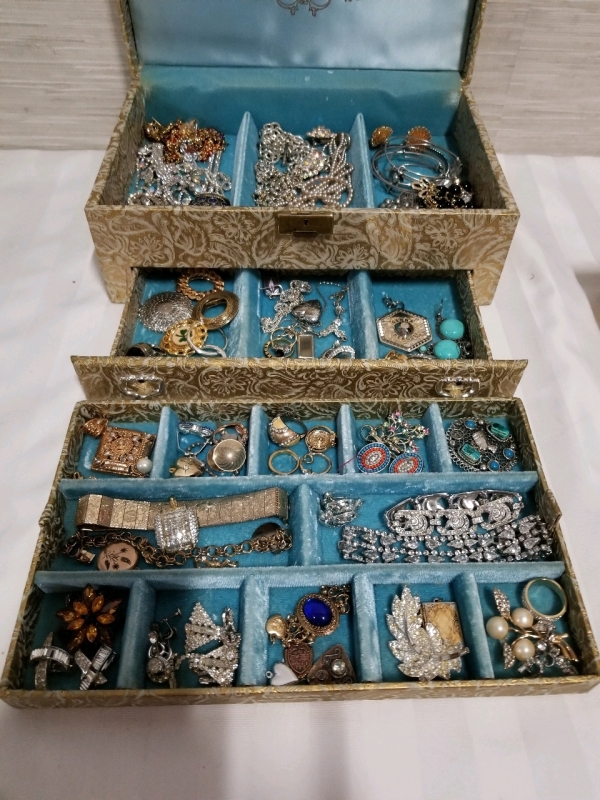 Vintage jewelry box with contents