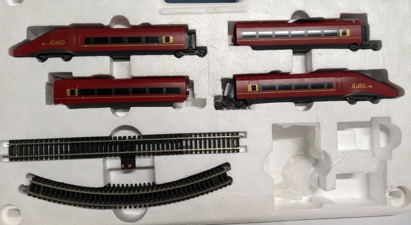 4 Lima Model Trains and 12 Peices of Track.