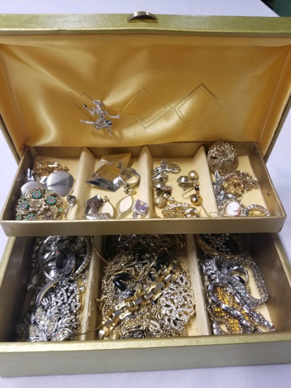 Vintage jewelry box with contents