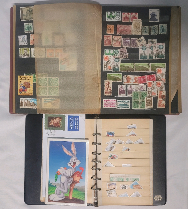 World Postage Stamp Lot in Two (2) Stamp Books . Canada , USA , Poland , Germany ++++