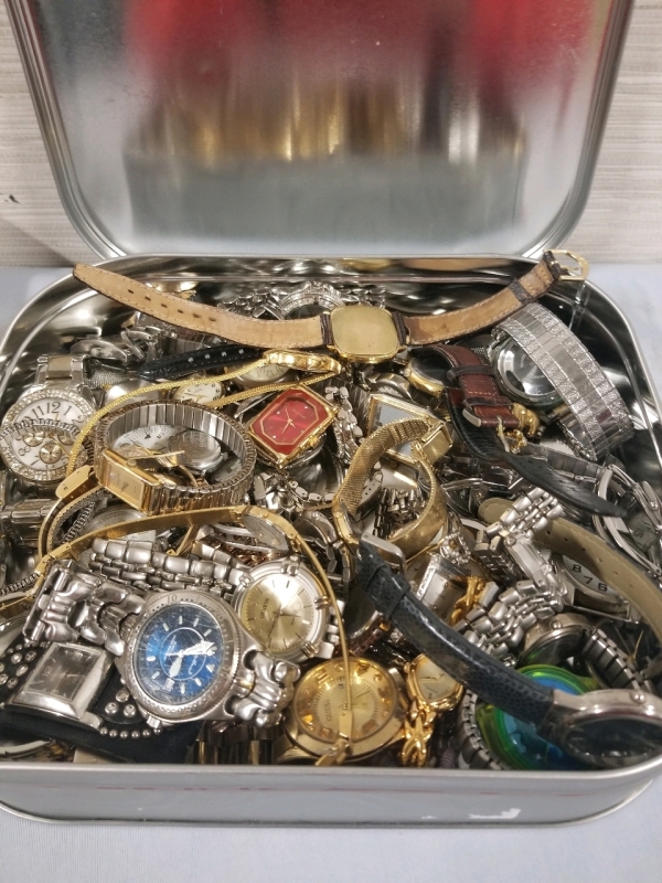 Cookie tin full of vintage to modern watches