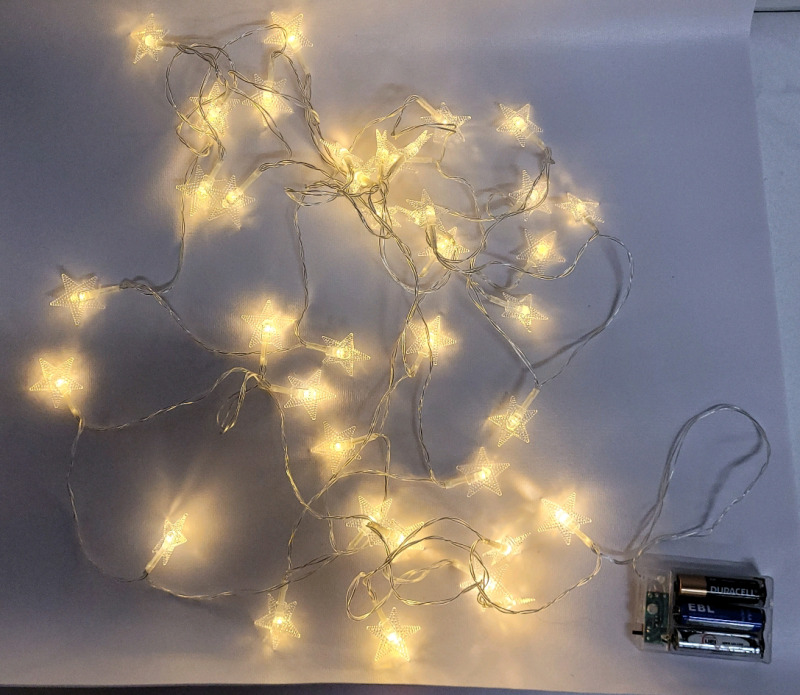 LED Star Fairy Lights String . Requires 3 AA Batteries . Back missing from battery case , working