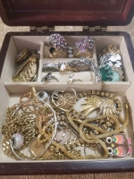 Small wooden jewelry box with contents