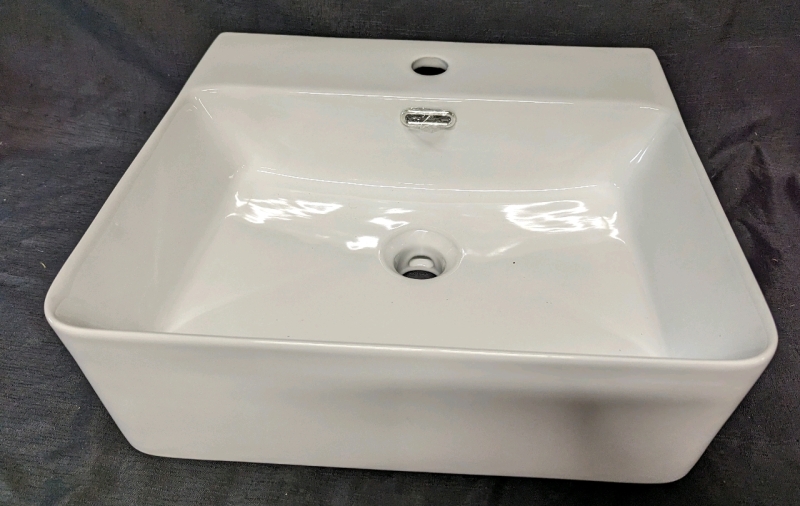 Bathroom Sink. 18.5" by 16.5" by 6". Drain 1.75" Across.