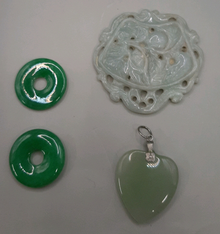 4 Jade Pendants. The largest is 2"