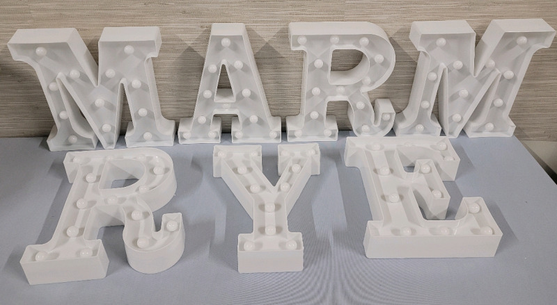 Plastic Light-Up Letters : M M R R A Y E . All Letters measure 8 3/4" tall .