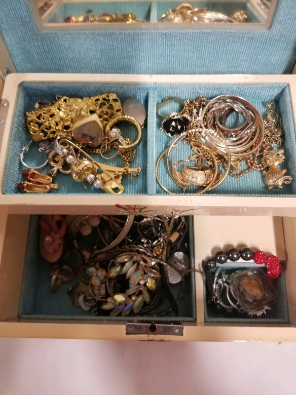 Vintage jewelry box with contents