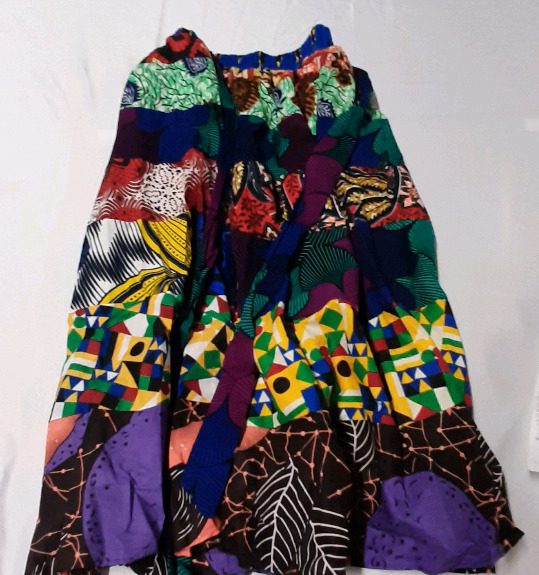 New Brightly Patterned Skirt. No Size Tag. Elastic Waist is 30" with Tie Belt.
