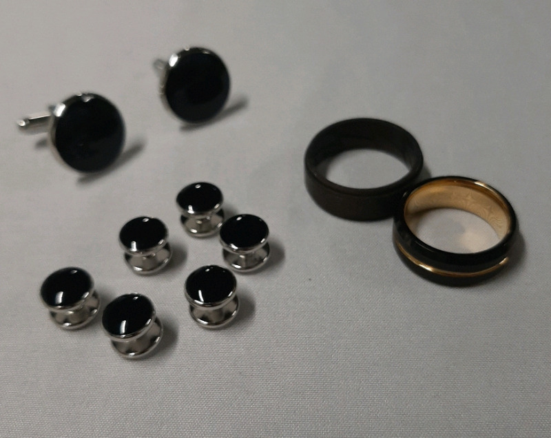 As New Set of Cufflinks and Shirt Studs in Black & Silvertone, a Silicon Ring, a Size 7 Ring in Goldtone & Black