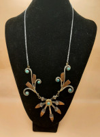 Vintage 24" Navaho Inspired Necklace. In the center it reads FC 07 300 WIN MAG