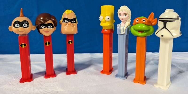 7 Pez Dispences. Incredibles, Simpsons and More! Tallest measures 4.5".