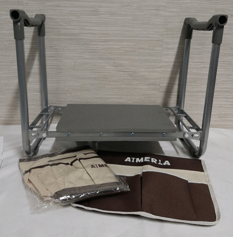 New Aimerla Garden Kneeler. Can also be used as a seat. Comes fully assembled & folds flat for easy storage. Comes with two pouches to hold tools etc.