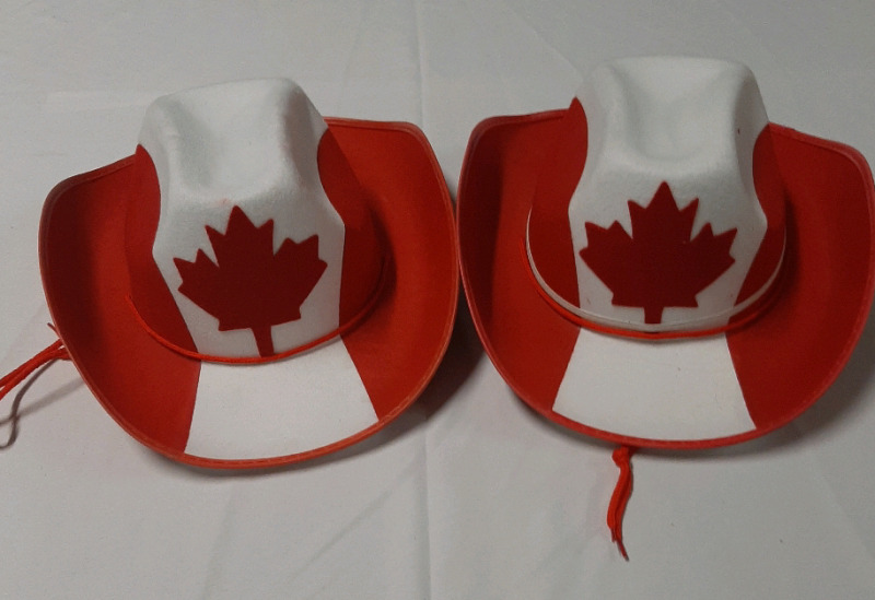 Two Canadian Stetsons. One has a removable bow.