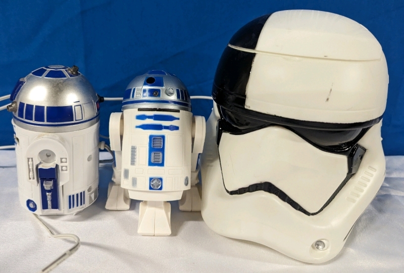 Star Wars Collector Lot. R2D2 Usb Powered Desk Vacuum, R2D2 Car Usb Charger and First Order Storm Trooper Helmet Popcorn Bucket. Helmet Measures 7" Tall.