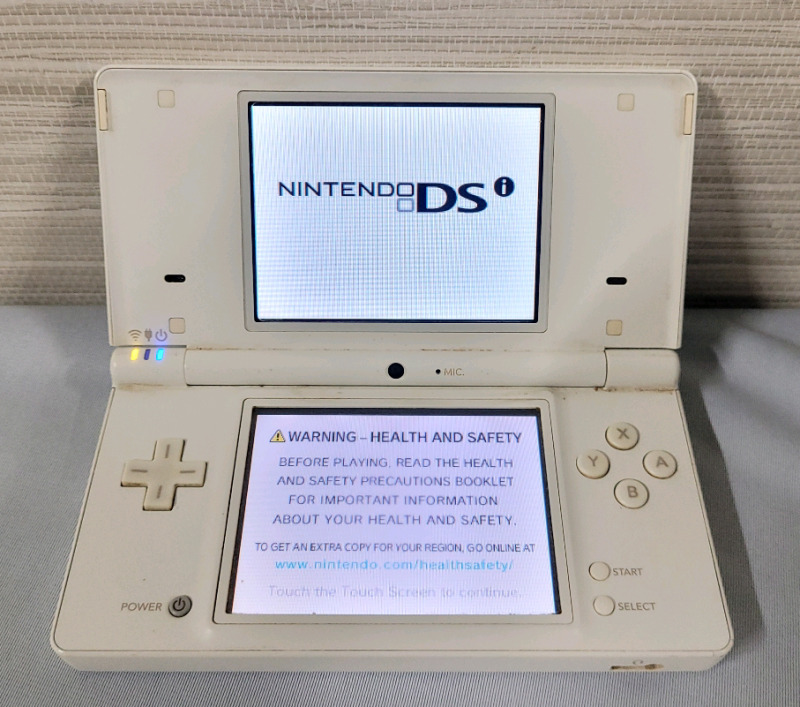 Nintendo DS Handheld Gaming System with NintenDogs Chihuahua & Friends Game .