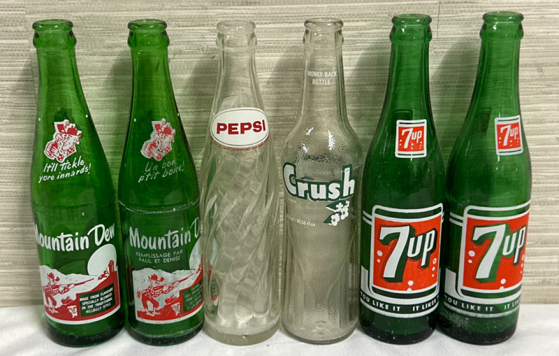 6 Vintage Pepsi co Glass Bottles 2 - Green It&rsquo;ll Tickle Your Innards! Mountain Dew Bottles 2 - Green 10 FL.OZ You Like It It Likes You 7 Up Bottles 1 - White & Red Clear Pepsi Bottle & 1 - 300ml Green & White Clear Crush Bottle