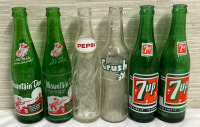 6 Vintage Pepsi co Glass Bottles 2 - Green It’ll Tickle Your Innards! Mountain Dew Bottles 2 - Green 10 FL.OZ You Like It It Likes You 7 Up Bottles 1 - White & Red Clear Pepsi Bottle & 1 - 300ml Green & White Clear Crush Bottle