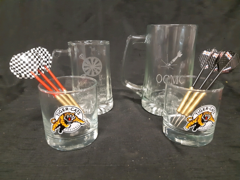 Set of 4 Bar Glasses and Set Of Darts, 1 Metro Toronto Area Dart League Glass Beer Mug ( 5.5" Tall ) 1 Oshawa Competition Mortorcycle Club Beer Mug ( 6.5" Tall ) 2 Football Tiger-Cats Whisky Glasses ( 3.5" Tall )