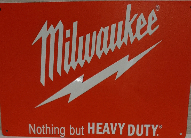 As New Metal Milwaukee Sign 11.75" X 5.75" Has a couple of dents