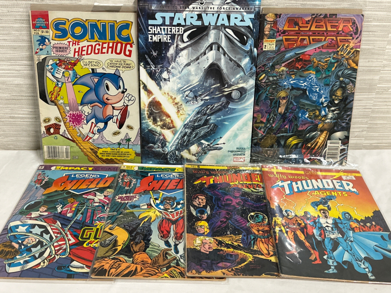 7 Assorted Comics Including 1 Star Wars Graphic Novel 1 Sonic The Hedgehog 1 Cyber Force 2 Legend of Shield & 2 Wally Woods Thunder Agents