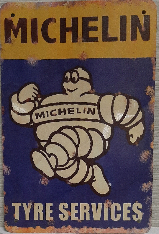 As New Metal Michelin Tyre Sign 11.75" X 5.75" Has a couple of dents