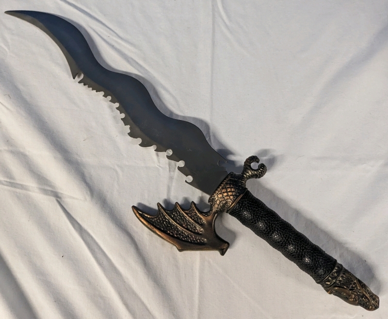 Replica Dagger with Kris Styled Blade with Sword Breaker Styled Edge. 14" Blade, 22" Total Length.