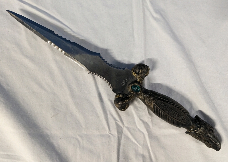 Replica " Robinhood" Dagger with Partially Serrated Edges. Comes with point guard. 9" Blade, 15" Total Length.