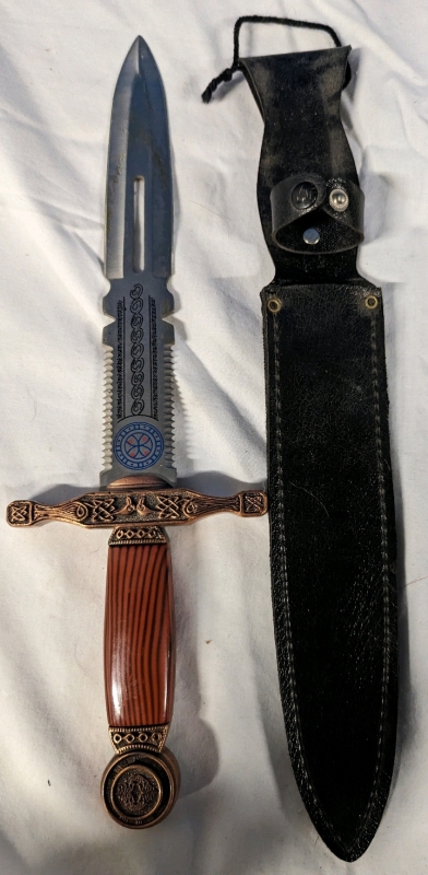 Replica Dagger with Serrated Blade At Hilt and Leather Like Sheath. 9" Blade, 14.5" Total Length.