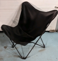 Folding Leather-Like Papillion Chair. 33" by 29" by 32".