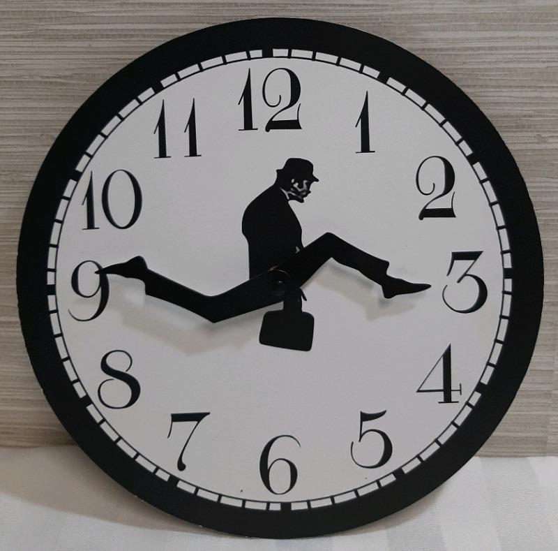 New Monty Pythons Ministry of Silly Walks Wall Clock. Takes 1 AA Battery and is 9.75" Wide