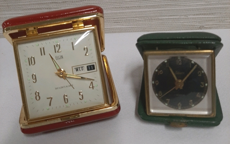 2 Vintage Travel Alarm Clocks The Red Elgin Sounds Like it's Woking but the Hands do not Move The Smaller Green Kaiser is not working