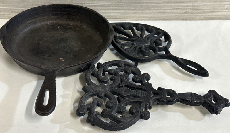 3 Vintage Cast Iron Pieces Including 8&rdquo; Frying Pan & Two Footed Cast Iron Trivets