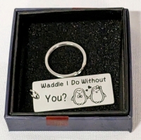 11 (Eleven) New "Waddle I Do Without You" Keychains in Gift Boxes.