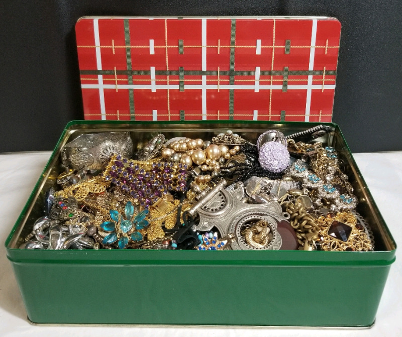 Tin full of vintage to modern jewelry