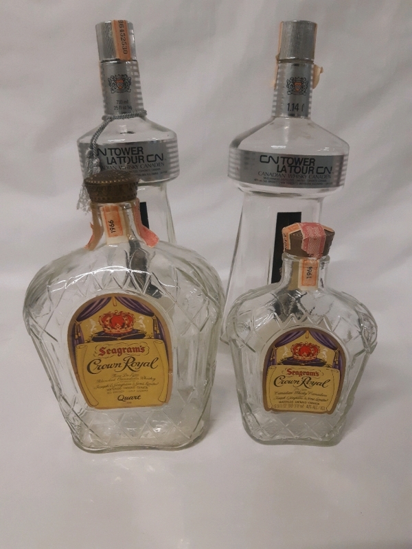 4 Vintage Alcohol Bottles 2 CN Tower Canadian Whiskey Clear Glass Bottles & 2 Seagram's Crown Royal Bottles ( Size Varries From 6.5 - 12.5 Inches Tall )