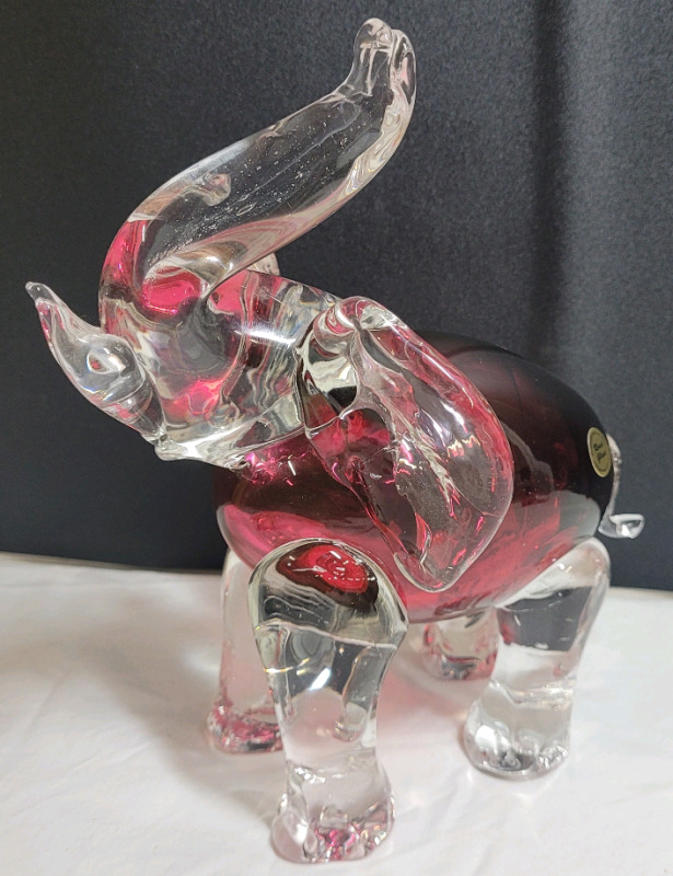 Rossi Glass Cranberry & Clear Glass Home Decor Elephant , measures 7 5/8" tall . Small Chip on tall