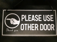New "Please Use Other Door" Plastic Hanging Door/ Wall Sign ( 10" x 5" )