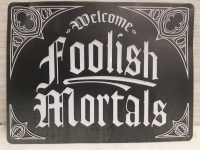 New | " Welcome Folish Mortals " Metal Hanging Wall Sign ( 16" x 12" )