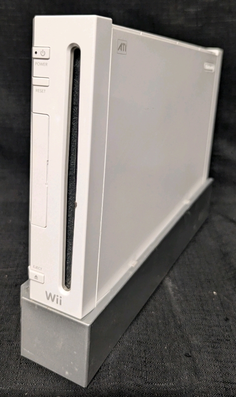 Nintendo Wii Console with 1 Wiimote, Nunchuk, Motion Sensor Bar, Nunchuk Wireless Mount, Wii Network Adaptor and Wiimote Protective Case.