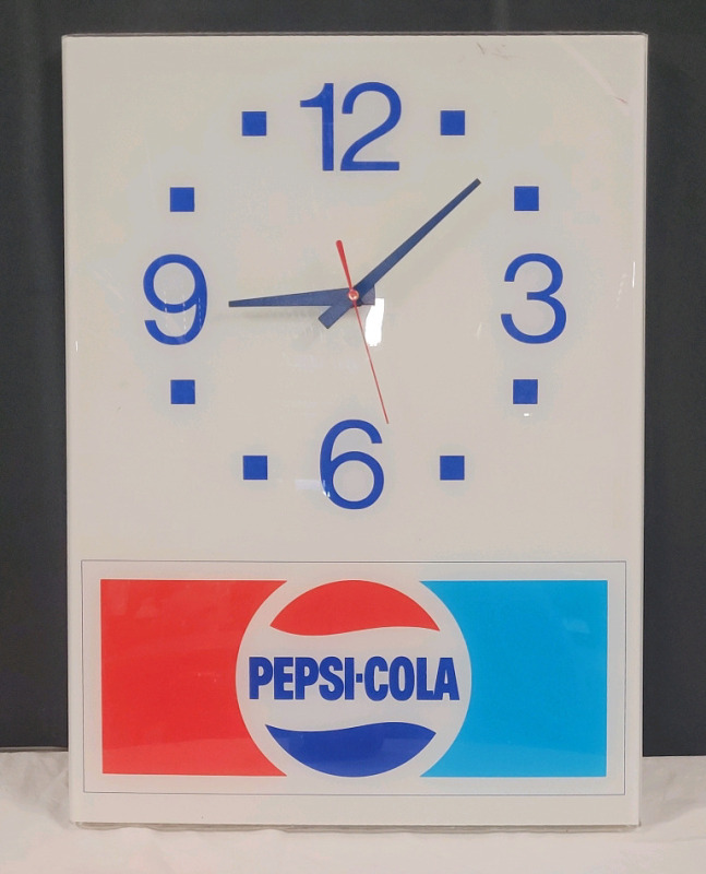 Pepsi-Cola Wall Clock . Measures 11 3/4"×16" . Battery Operated , Requires One (1) AA Battery . Tested Working