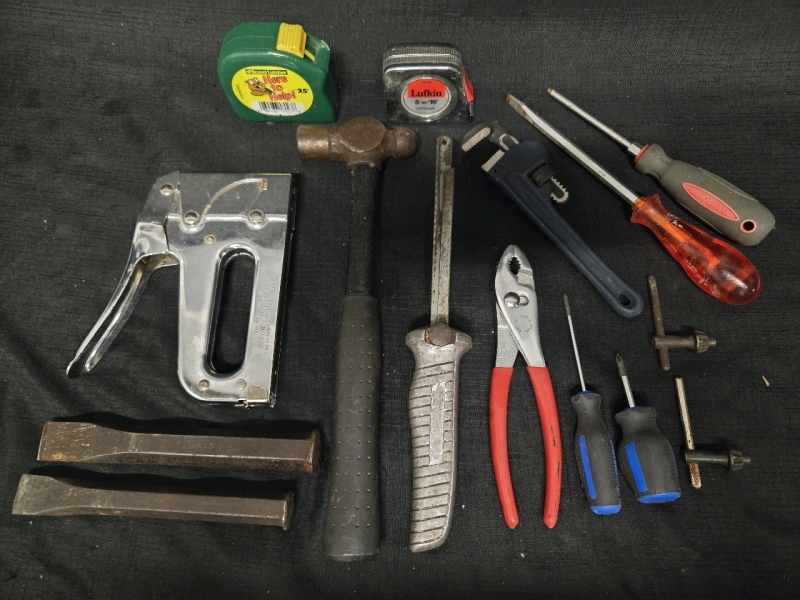 Lot of 15 Assorted Tools Includes But Isn't Lmited To; A T-50 Stapler, 2 Measuring Tapes From 16'-25', A Wrench, Screwdrivers & 2 Chisel Heads