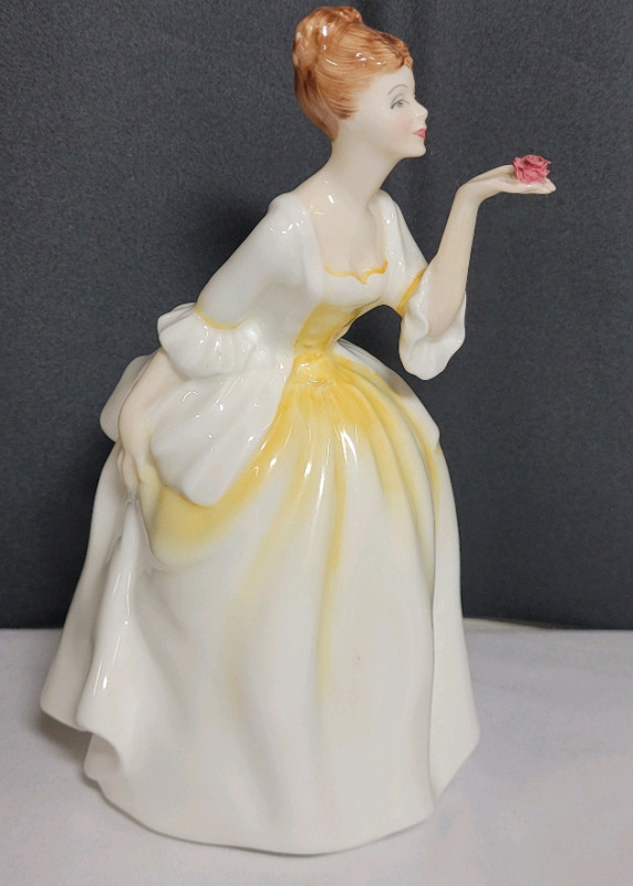 Vintage Royal Doulton " Flower of Love " Figurine , Signed on Bottom . Measures 7.5" tall . Teeny-Tiny very small chip on rose