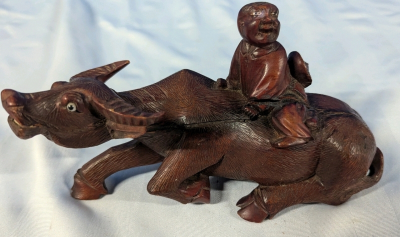 Water Buffalo Carving with Rider. 8" Long. 2 Large Cracks Present. See Photos.