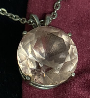 Amazing Round Cut Rose Quartz Sterling Pendant on 16’’ silvertone chain with ring clasp.